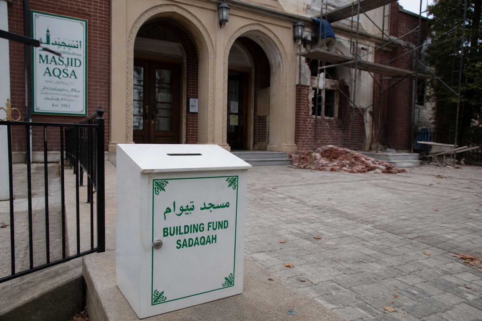 A mosque building-fund box during a small renovation.